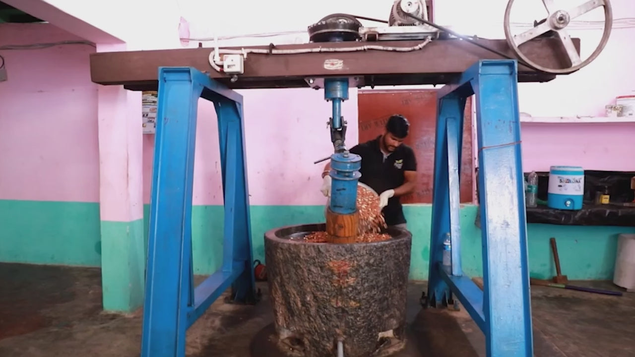 Load video: Watch this video showcasing the process of extracting Stone Cold Pressed Yellow Mustard Oil using a cold-pressed oil machine.